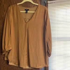 Gold satin blouse with a v-neck